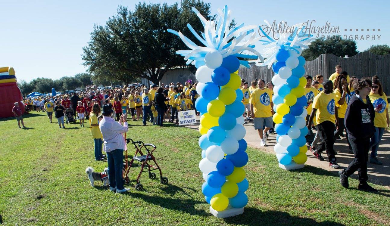 Families walking together at an Up With Downs community event